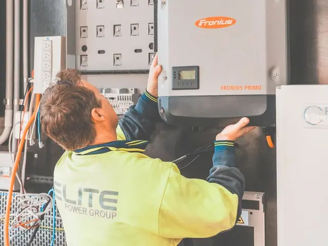 Electrician installing electrical equipment on site